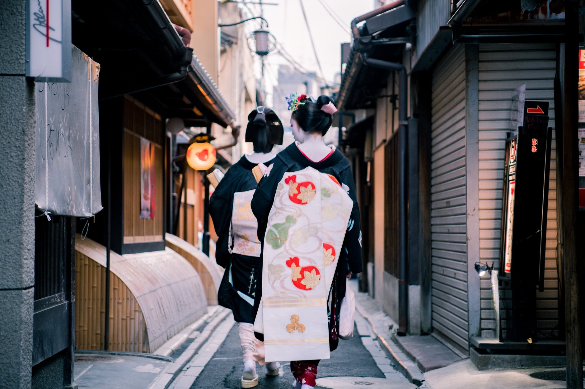 women walking on alley