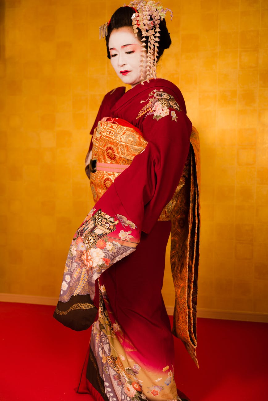 woman wearing red and gold kimono