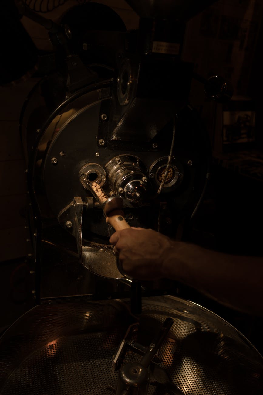 a person roasting coffee beans